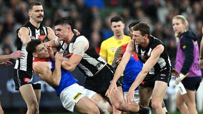 Jack Viney of the Demons remonstrate with Brayden Maynard of the Magpies after Angus Brayshaw of the Demons was knocked out during the AFL First Qualifying Final match between Collingwood Magpies and Melbourne Demons at Melbourne Cricket Ground, on September 07, 2023, in Melbourne, Australia. (Photo by Quinn Rooney/Getty Images)