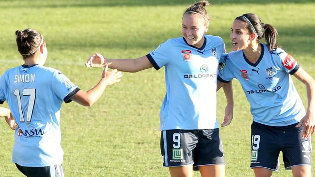 Celebrations after Caitlin Foord scores.