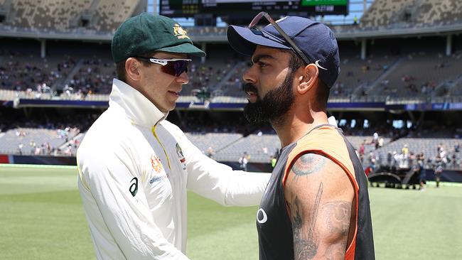 Virat Kohli looks straight past Tim Paine after the Perth Test. Picture: Getty