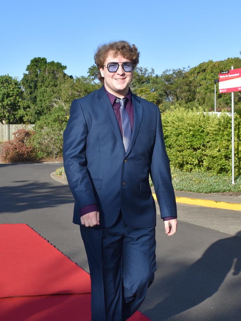 RIVERSIDE FORMAL: Liam Sollar-Allen walks down the red carpet at the Riverside Christian College Formal. Photo: Stuart Fast