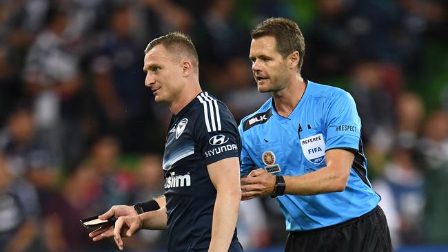 Victory player Besart Berisha (left) is told to leave the field by referee Chris Beath.