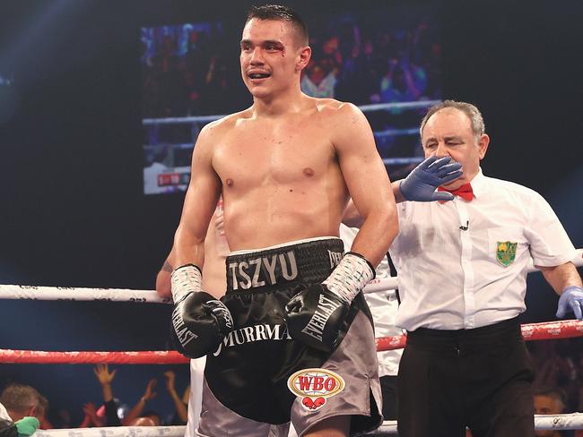 NEWCASTLE, AUSTRALIA - MARCH 31: Tim Tszyu reacts after Dennis Hogan's team throw his towel in the ring during the WBO Global Super Welterweight title fight between Tim Tszyu and Dennis Hogan  at Newcastle Entertainment Centre on March 31, 2021 in Newcastle, Australia. (Photo by Cameron Spencer/Getty Images)