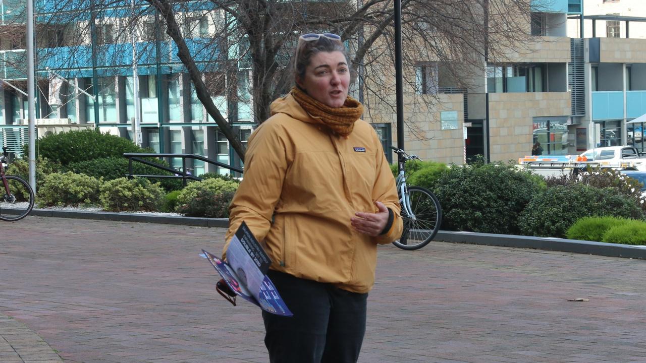 NOFF Campaigner Jess Coughlan speaks to protesters outside Seafood Directions in Hobart. Picture: Elise Kaine