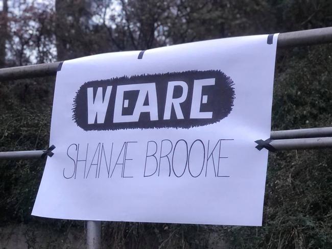 A group of locals gathered at Ms Edwards’ memorial site following news of the arrest.