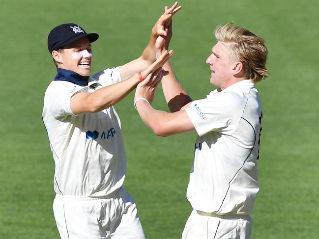 Wil Parker and Will Sutherland  from the Bushrangers celebrate the dismissal of Jake Weatherald of the Redbacks during day 3 of the Marsh Sheffield Shield cricket match between the South Australia Redbacks and the Victoria Bushrangers at Adelaide Oval in Adelaide, Sunday, March 8, 2020. (AAP Image/David Mariuz) NO ARCHIVING, EDITORIAL USE ONLY, IMAGES TO BE USED FOR NEWS REPORTING PURPOSES ONLY, NO COMMERCIAL USE WHATSOEVER, NO USE IN BOOKS WITHOUT PRIOR WRITTEN CONSENT FROM AAP