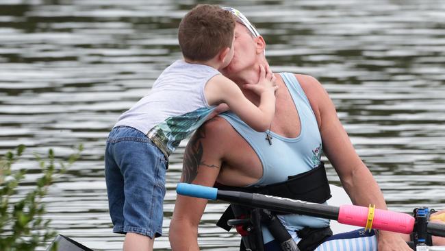 Erik Horrie congratulated by his young son Lewis after a race.