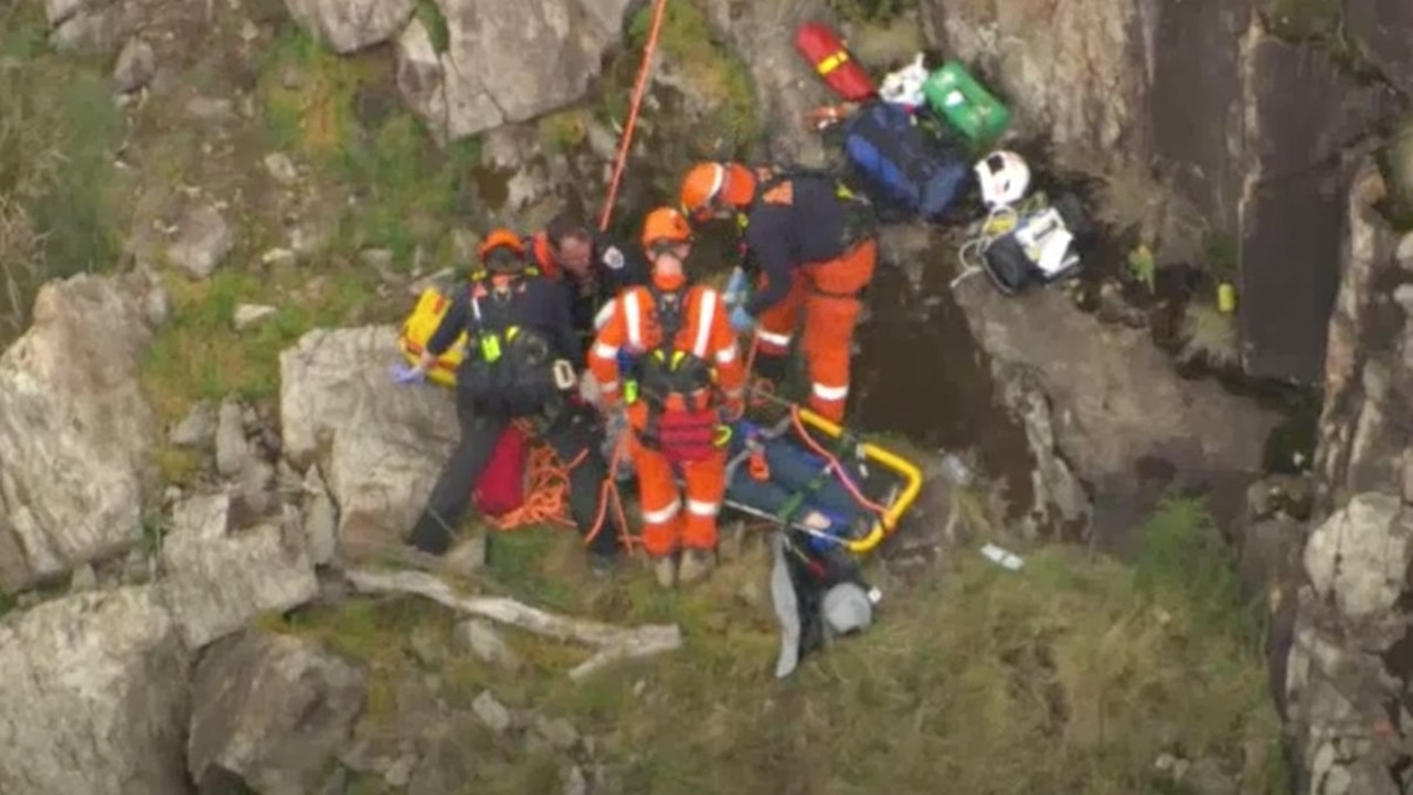 A large number of rescuers worked to get down the cliff to where the man fell.