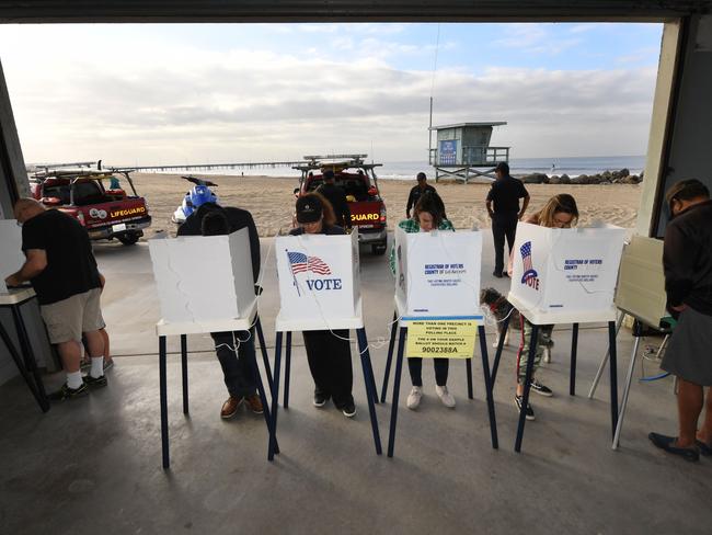 People vote beside the beach at the Venice Beach Lifeguard station in California. Picture: AFP