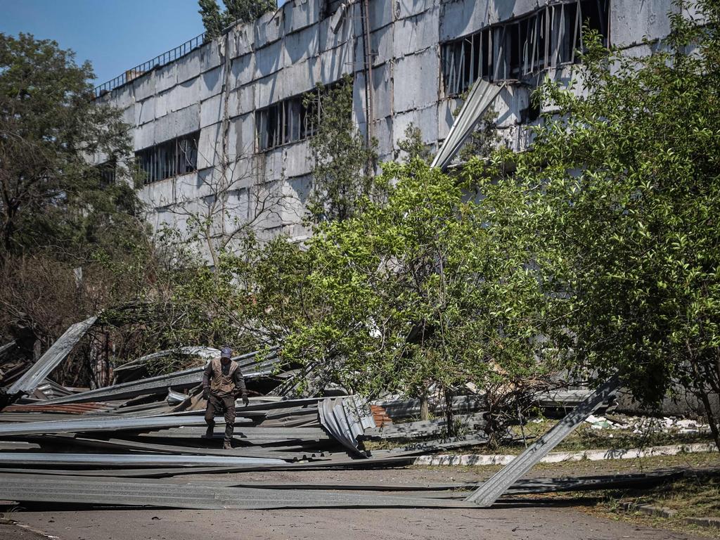 A worker walks among the remains of an industrial building that has been damaged after a Russian missile strike in Odessa. Picture: AFP