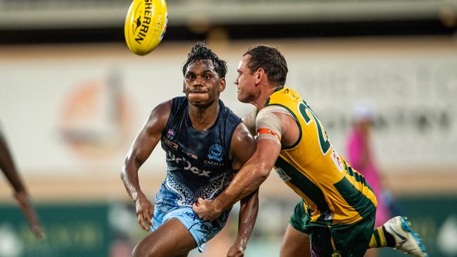 Steven Motlop tackles Phoenix Spicer in the Round 10 match between Darwin Buffaloes and PINT. Picture: Pema Tamang Pakhrin