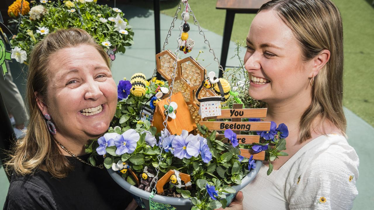 Britt Hart (left) and Simone Kendall-Robertson representing Toowoomba West Special School, the People's Choice category winner of Cobb and Co Hanging Basket Display of Toowoomba's Carnival of Flowers. Picture: Kevin Farmer