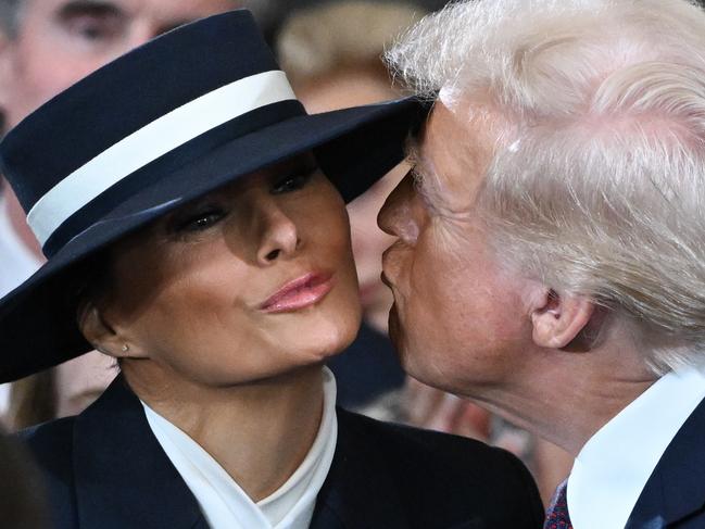 WASHINGTON, DC - JANUARY 20: U.S. President-elect Donald Trump kisses Melania Trump at his inauguration in the U.S. Capitol Rotunda on January 20, 2025 in Washington, DC. Donald Trump takes office for his second term as the 47th President of the United States. (Photo by Saul Loeb-Pool/Getty Images)