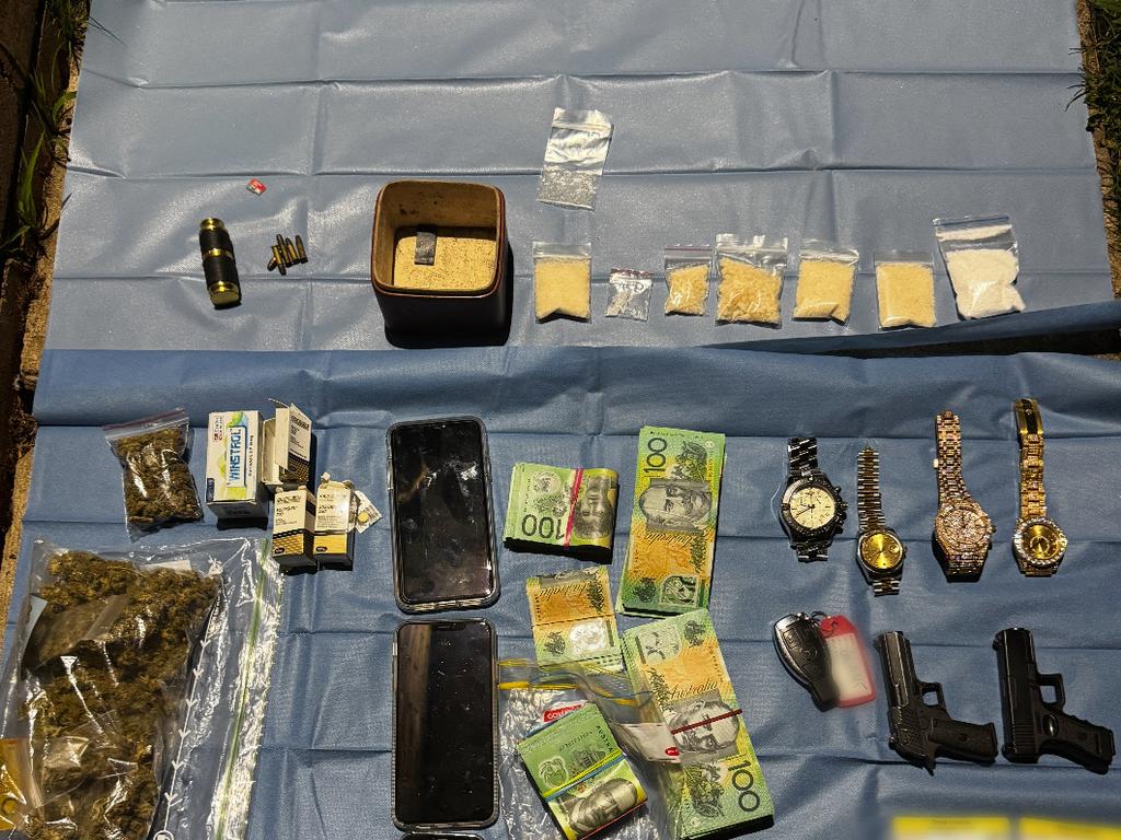 More than $55,000 in cash, a baton, two replica firearms, 213 grams of meth, 19.5 grams of cocaine, 82 grams of cannabis and 29 grams of ketamine were found. Photo: NSW Police.