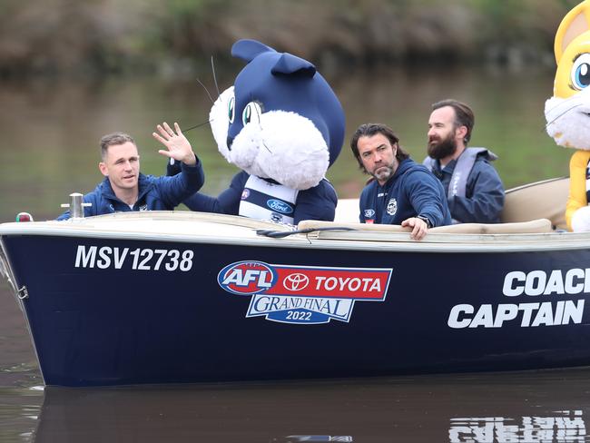 Former Geelong skipper Joel Selwood waves at fans on the distant banks of the Yarra. Picture: David Crosling