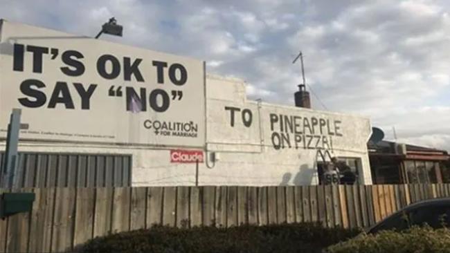 In 2017, WiseGuise Pizza gained international attention for humorously altering the meaning of an anti-same-sex marriage billboard near their business. Picture: Instagram