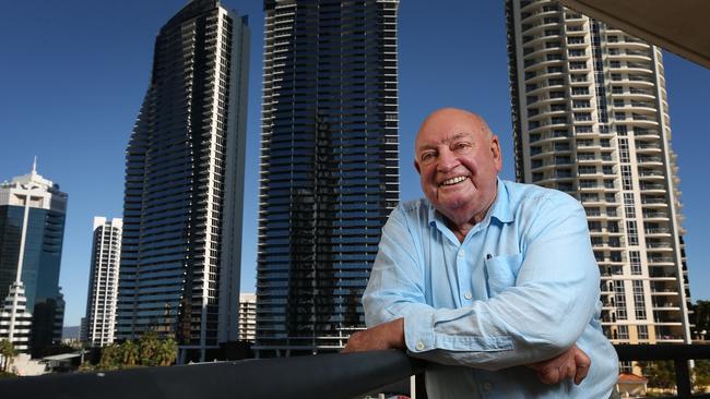 Max Christmas on the balcony of one of his buildings surrounded by high rise in Surfers Paradise, Gold Coast. Picture: Lyndon Mechielsen