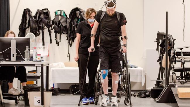 Accident victim Gert-Jan Oskam tests the AI interface at Lausanne University Hospital.His strides are made possible by a set of implants that sit in his skull and monitor the electrical activity of brain cells. Picture: EPFL/Jimmy Ravier