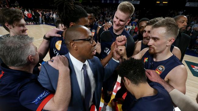 Adelaide 36ers coach Joey Wright with his players after the team’s four-point home win over Cairns Taipans. Picture: AAP/Kelly Barnes