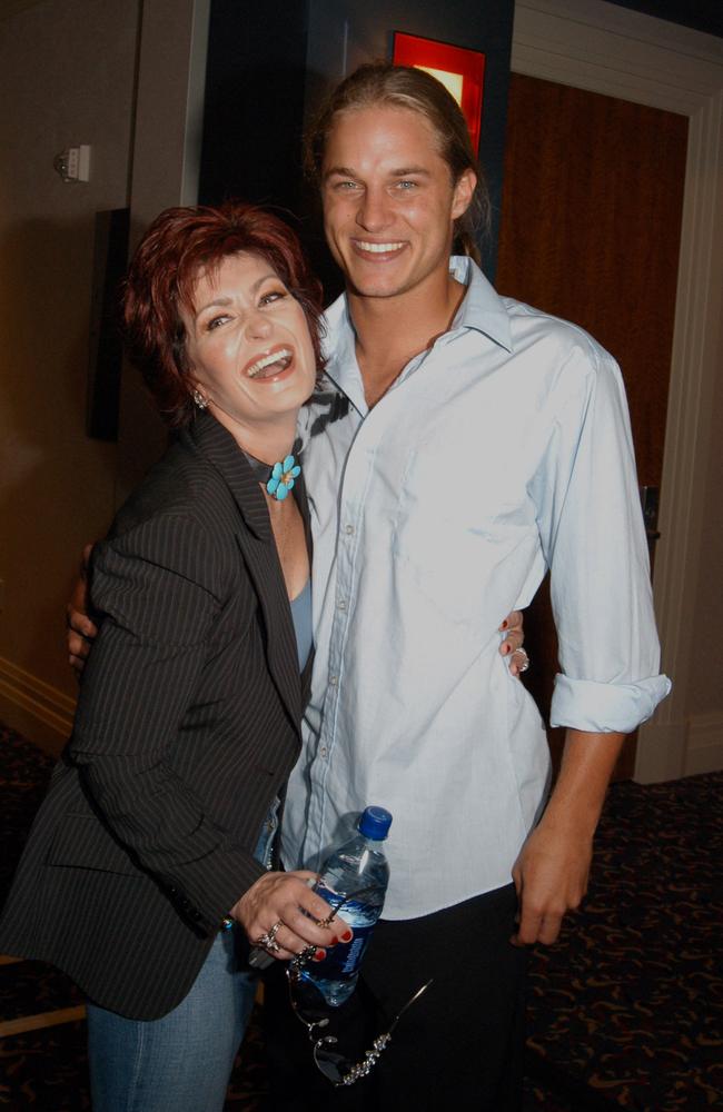 Sharon Osbourne gets up close and personal with Travis at the Renaissance Hotel in Hollywood. Picture: Barry King/WireImage