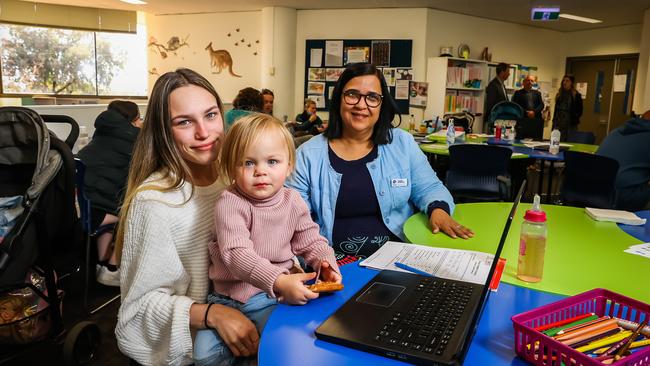 Christies Beach High School student Yasmin with Isla, 2, and teacher Del Brownridge. Picture: Tom Huntley