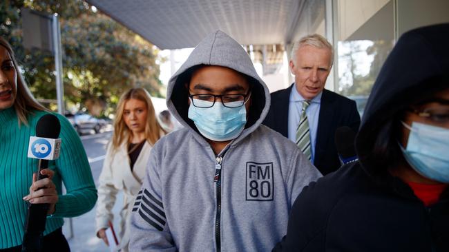 Mr Khanna covered his face with a disposable mask and kept the hood of his jacket pulled up as he walked silently past waiting media. Picture: NCA NewsWire / Nikki Short