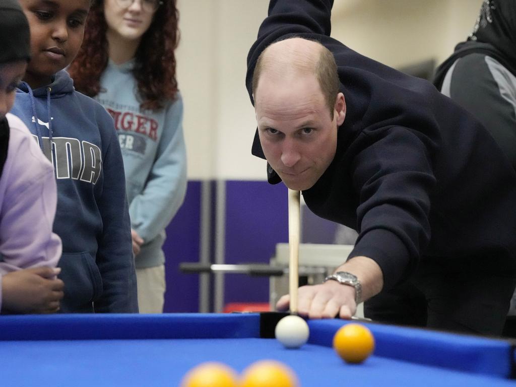 William plays pool during a visit to WEST in London, England. Picture: Getty Images