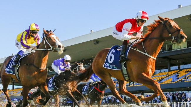 SYDNEY, AUSTRALIA - JULY 30: Hugh Bowman (red and white) on Pizarro wins race 6 the Atc Thank You Stable Staff Handicap during Sydney Racing at Rosehill Gardens on July 30, 2022 in Sydney, Australia. (Photo by Mark Evans/Getty Images)