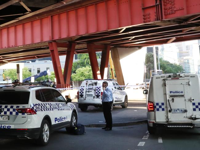 Police at the scene where a body has been found on City road under the Kings way overpass the morning after New Years celebrations in Melbourne. Sunday, January 1, 2023. Picture: David Crosling