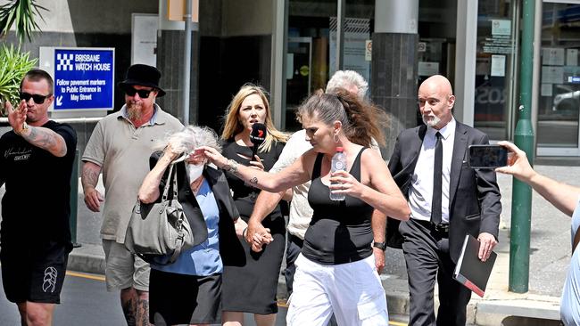 Supporters of the couple try to block cameras from filming them as they leave Brisbane Magistrates Court. Picture: NCA NewsWire / John Gass