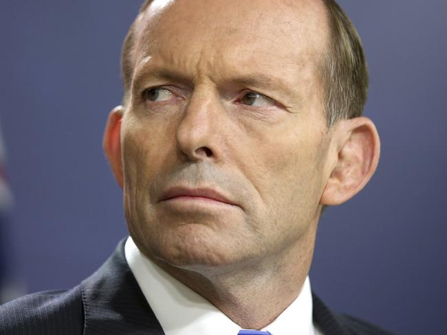FILE - In this Sept. 19, 2014, file photo, former Australian Prime Minister Tony Abbott speaks during a press conference, in Sydney. Australiaâ€™s prime minister Friday urged restraint in the same-sex marriage debate after Abbott said he was head-butted by a gay rights advocate while walking in a city street. (AP Photo/Rick Rycroft, File)