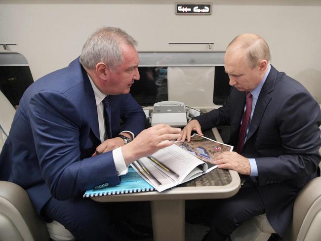 Russian President Vladimir Putin speaks with Dmitry Rogozin, the former head of Russia’s space agency Roscosmos. Picture: Sputnik / AFP