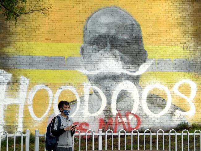 SYDNEY, AUSTRALIA - NewsWire Photos FEBRUARY, 17, 2021: Graffiti over a mural of RFS hero Shane Fitzsimmons at Erskineville train station in Sydney. Picture: NCA NewsWire/Joel Carrett