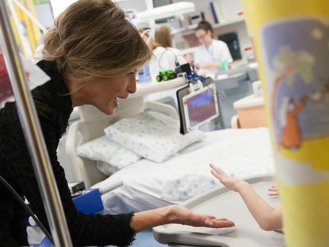 Melania Trump speaks to a child during her visit at the Vatican-owned Bambino Gesu paediatric hospital, in Rome. Picture: L'Osservatore Romano