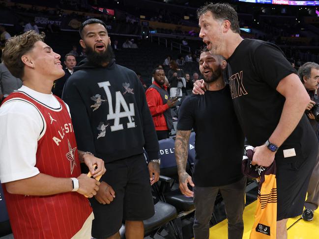 Broncos stars Reece Walsh, Payne Haas and Adam Reynolds talk with San Antonio Spurs assistant coach Matthew Nielsen. Picture: Sean M. Haffey/Getty Images/AFP