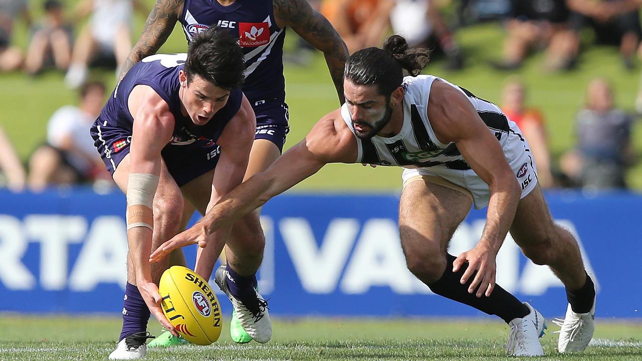 Andrew Brayshaw and Brodie Grundy compete for a ball on Monday night.