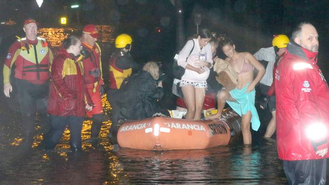 SES crews evacuate Carole Lloyd and family members from her Narrabeen home. Picture: Damian Shaw. Picture: Damian Shaw