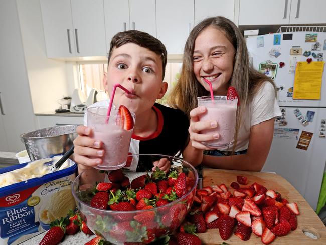 Shoppers are slowly gaining confidence in strawberries. Bray, 9, and his sister Ava-Grace enjoying a strawberry smoothie. Picture: Nathan Edwards