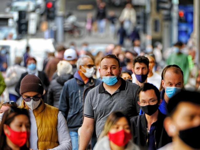 MELBOURNE, AUSTRALIA - NewsWire Photos AUGUST 1, 2021:  People walk around the city in Melbourne.Picture: NCA NewsWire / Luis Enrique Ascui