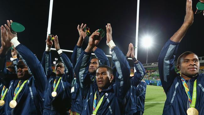 The Fijian team celebrates winning Olympic gold.