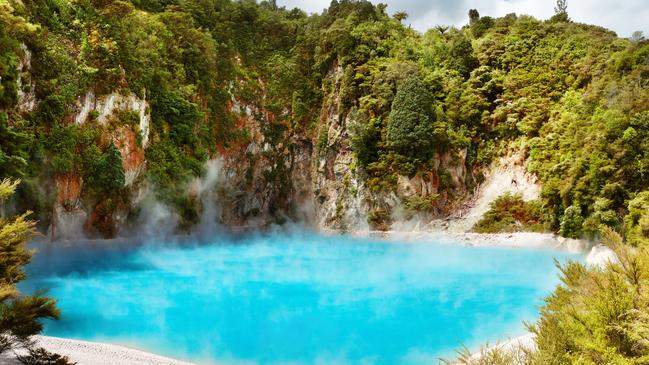 The Inferno Crater Lake in Waimangu volcanic valley is one of many tourist attractions in New Zealand.