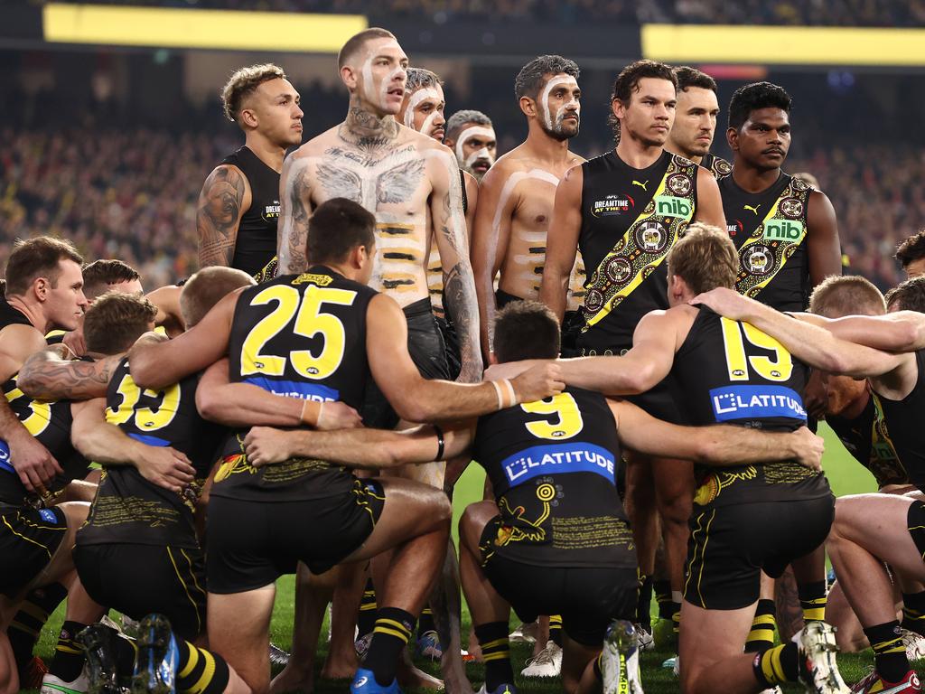 Richmond players take a knee around their Indigenous teammates before Dreamtime at the G. Picture: Michael Klein