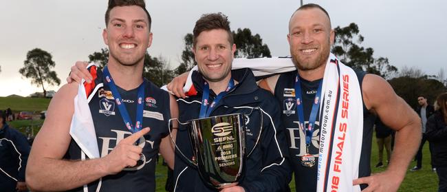 Berwick co-captains Bryce Rutherford (L) and Madison Andrews with Stewart Kemperman. after this year’s grand final.