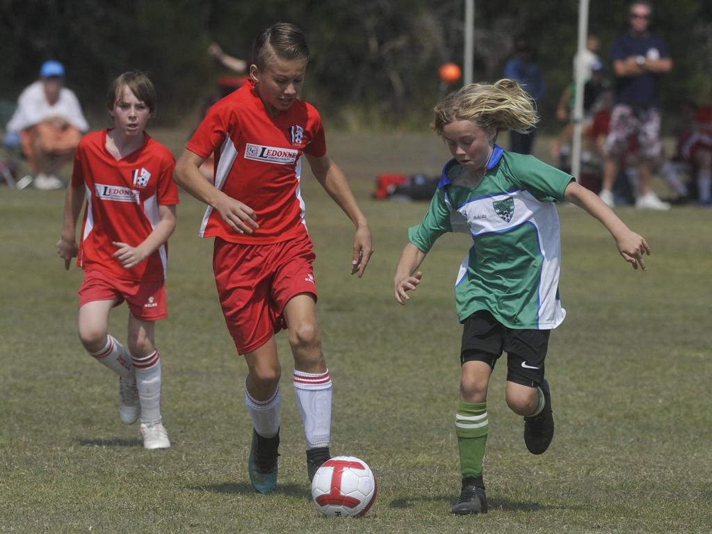 Maclean White's Jake Moore goes up against Majos Monsters' Kyron Nipperess in the 12s grand final at Yamba on Saturday