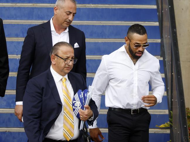 Josh Addo-Carr leaving Belmore Sports Ground with his lawyer Elias Tabchouri (left) and manager Mario Tartak (back) after a meeting with the Bulldogs board over his drug driving scandal. Picture: Jonathan Ng