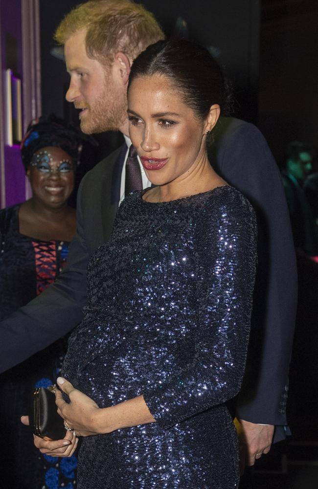 The Duchess cradled her baby bump at the event. Picture: Paul Grover - Pool/Getty Images