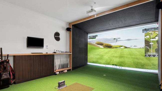 The vendor is a passionate golfer and set up a golf simulator in the oversized garage.