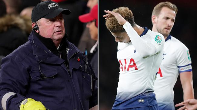 Tottenham midfielder Dele Alli (right) reacts after being hit in the head by a bottle thrown from the stands. A security guard (left) is pictured removing the bottle from the field.