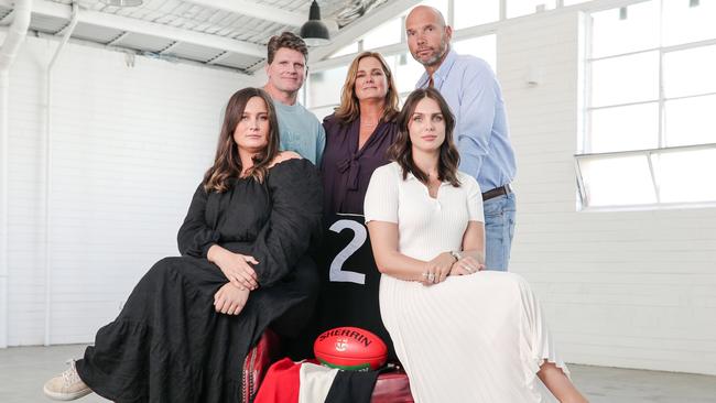 Robert Harvey, Anita Frawley, Stewart Loewe and Anita's daughters Chelsea (left) and Danielle (right) with Danny Frawley's famous No.2 St Kilda guernsey. Picture: Corey Scicluna