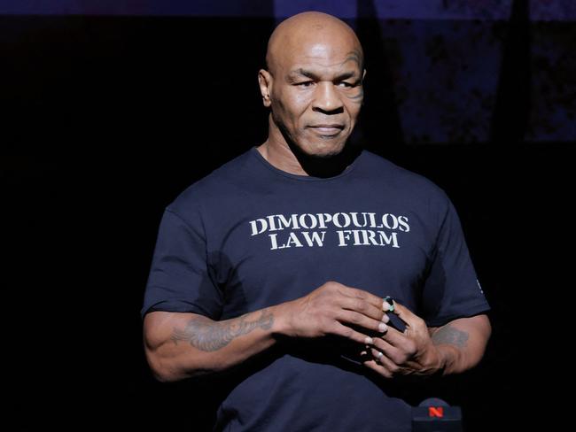 Former US boxer Mike Tyson speaks at a press conference at the Apollo Theatre in New York, on May 13, 2024. Former heavyweight boxing champion Mike Tyson's July 20 fight against YouTube sensation Jake Paul in Dallas will be a sanctioned heavyweight professional bout, fighters and promoters announced on April 29. The fight will be over eight two-minute rounds with the result to count on the record of both Paul and Tyson, who lost his last official bout in 2005. (Photo by Kena Betancur / AFP)