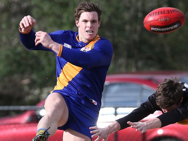 Brad Lowe gets a kick away. Picture: Hamish Blair